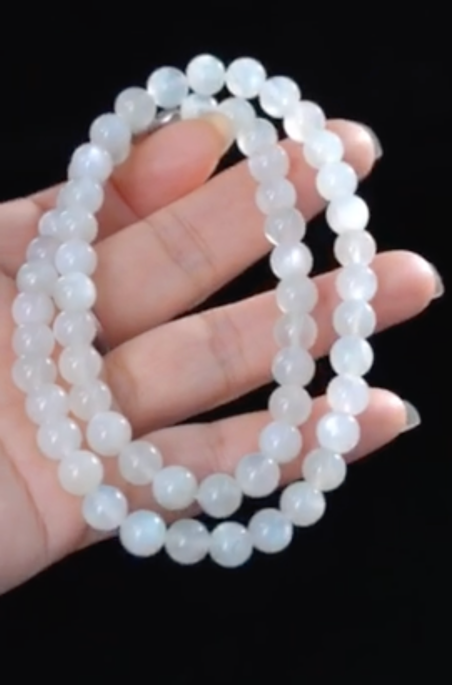 White moonstone necklace and bracelet set worn as jewelry