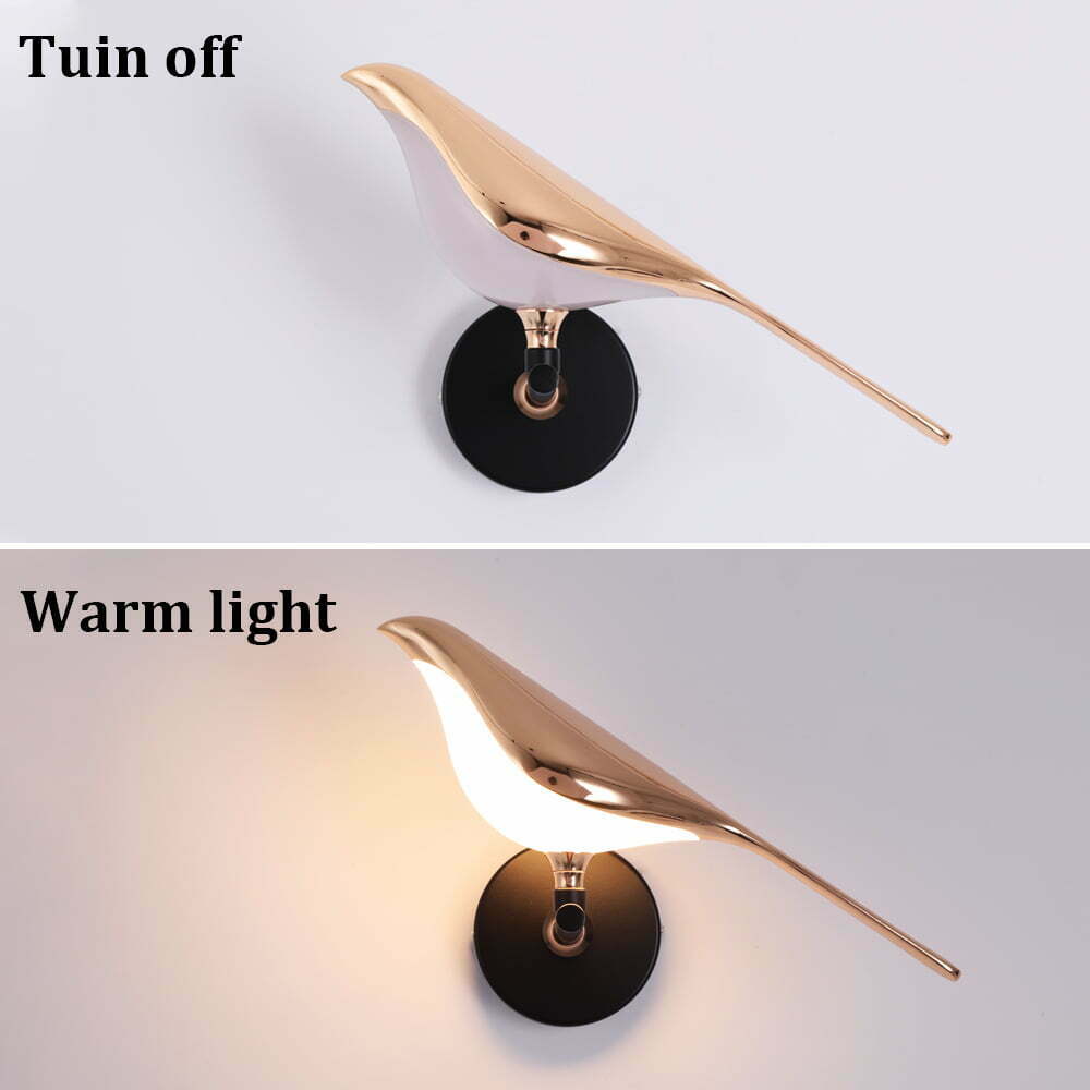 Bird wall lamp lit in warm white light mode